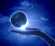 Image of earth planet on hand