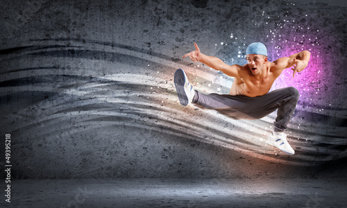 Photo: young man dancing hip hop with color lines young man dancing hip hop with color lines
