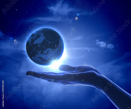 Photo: Image of earth planet on hand Image of earth planet on hand