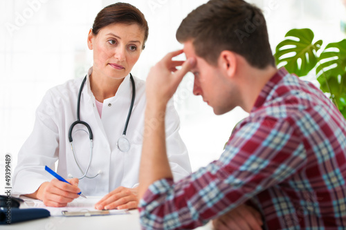 Photo: doctor with male patient doctor with male patient