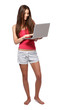 beautiful brunette teenager girl with laptop isolated on white