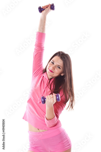 Photo: girl is engaged in fitness with dumbbells girl is engaged in fitness with dumbbells