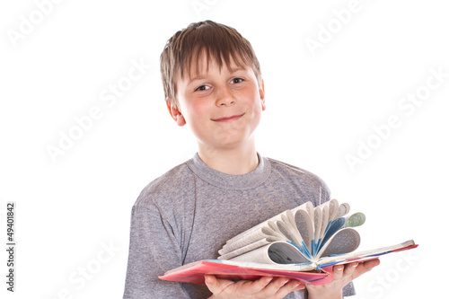 Photo: boy looks at the book boy looks at the book