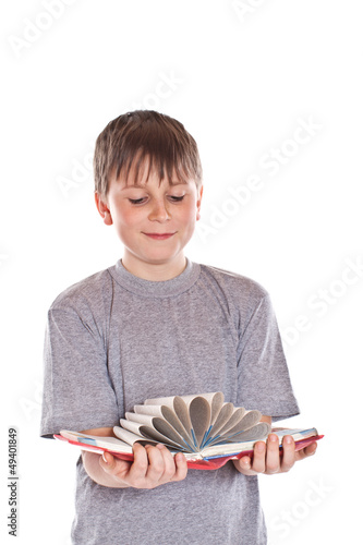 Photo: boy looks at the book boy looks at the book