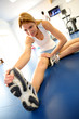 Woman stretching out in gym center