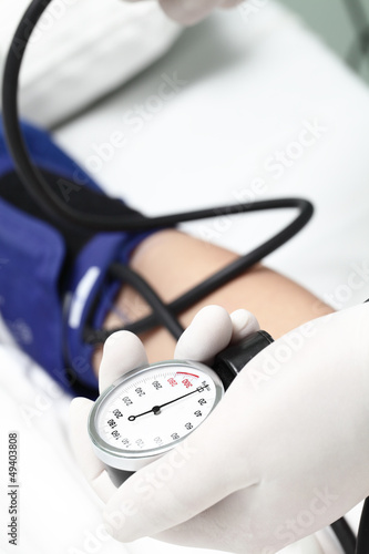Photo: Cardiologist measure blood pressure Cardiologist measure blood pressure