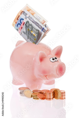 Photo: Rosa Sparschwein mit Münzen und Geldscheinen- Pink piggy bank w Rosa Sparschwein mit Münzen und Geldscheinen- Pink piggy bank w