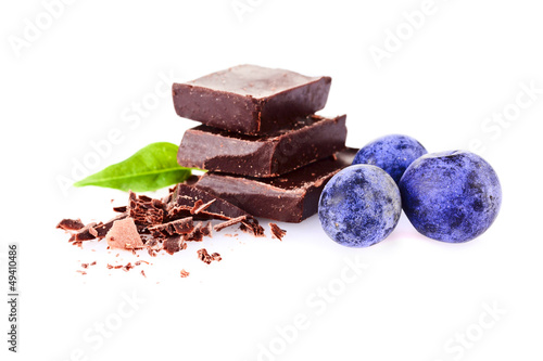 Photo: a handful of blueberries and slices of chocolate a handful of blueberries and slices of chocolate