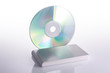 Illustration: External hard disk and blank dvd on white background with reflec External hard disk and blank dvd on white background with reflec