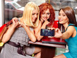 Women at laptop  in a cafe.