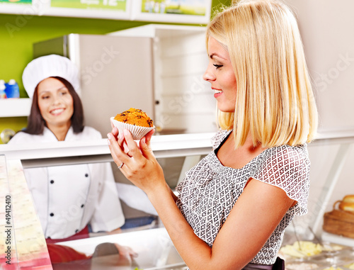 Photo: Young woman at cafeteria. Young woman at cafeteria.