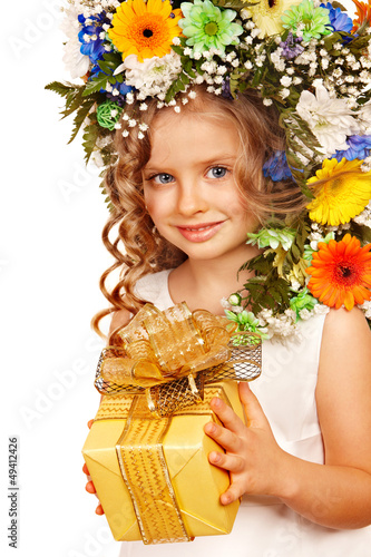 Photo: Child with gift box and flower. Child with gift box and flower.