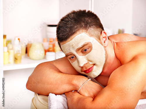 Photo: Clay facial mask in beauty spa. Clay facial mask in beauty spa.