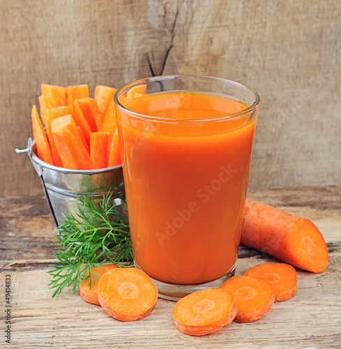 Photo: carrot juice and carrots segments carrot juice and carrots segments