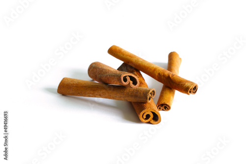 Photo: Cinnamon sticks or bark quills, isolated on white background Cinnamon sticks or bark quills, isolated on white background