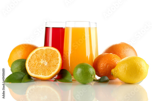 Photo: Glasses of juise with leafs and fruits isolated on white Glasses of juise with leafs and fruits isolated on white