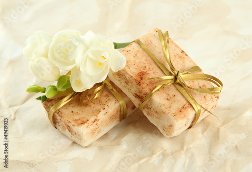 Photo: Natural handmade soap, on beige background Natural handmade soap, on beige background