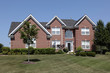 Large brick home circular window