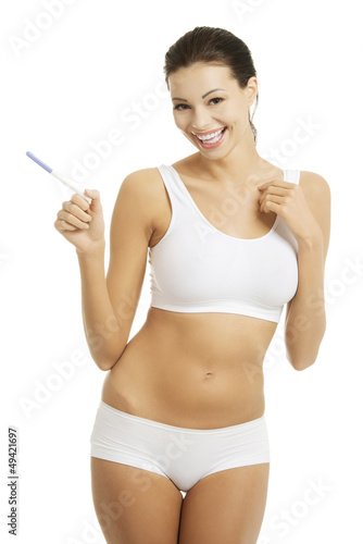 Photo: Pregnancy test - happy surprised woman Pregnancy test - happy surprised woman