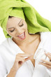 Attractive fit woman with moisturizer cream