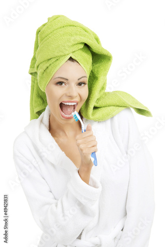 Photo: Happy attractive woman singing to tooth brush Happy attractive woman singing to tooth brush