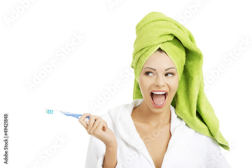 Photo: Happy attractive womanwith tooth brush Happy attractive womanwith tooth brush