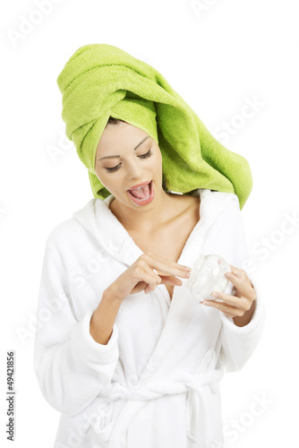 Photo: Attractive fit woman with moisturizer cream Attractive fit woman with moisturizer cream