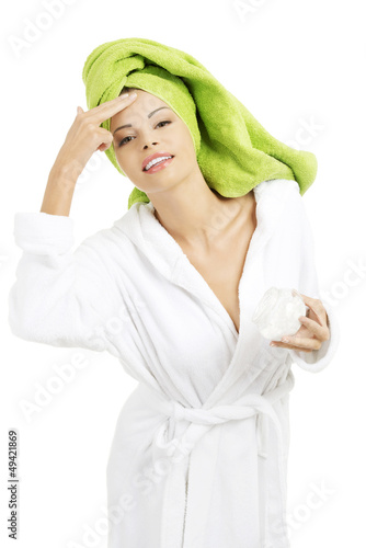 Photo: Attractive fit woman with moisturizer cream Attractive fit woman with moisturizer cream