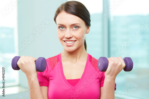 Photo: Girl with dumbbells Girl with dumbbells