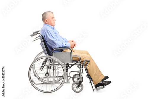 Photo: A disabled senior man posing in a wheelchair A disabled senior man posing in a wheelchair