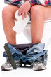 Man on toilet bowl