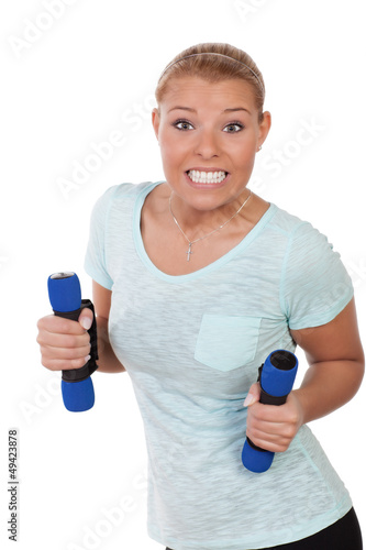 Photo: Young woman with dumbbells Young woman with dumbbells