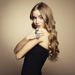 Portrait of beautiful blonde woman in black dress