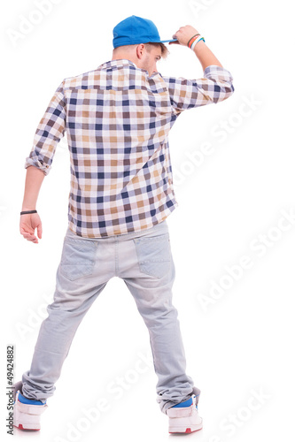 Photo: cool man with hand on his cap cool man with hand on his cap