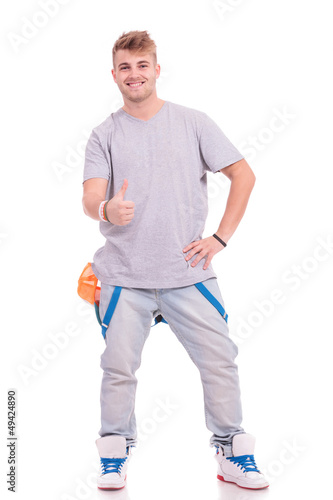 Photo: casual man shows thumb up casual man shows thumb up
