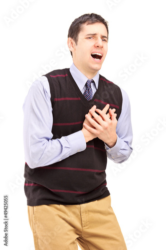 Photo: A young man having a heart attack A young man having a heart attack