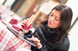 Photo: Smiling woman using tablet outdoors while having lunch. Smiling woman using tablet outdoors while having lunch.