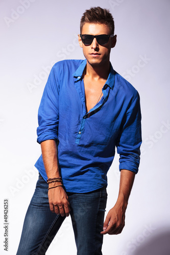 Photo: serious man with sunglasses posing serious man with sunglasses posing