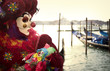 Clown with gondola and puppet in Venice