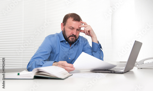 Photo: Old Business man with Laptop Old Business man with Laptop