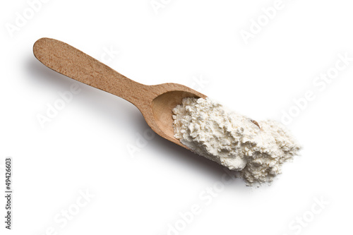 Photo: flour in wooden scoop flour in wooden scoop