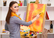 beautiful young woman painter at work,
