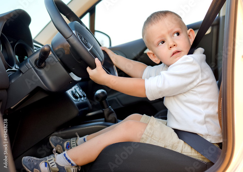 Photo: Little boy pretending to drive Little boy pretending to drive