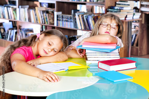 Photo: Kids asleep in a library Kids asleep in a library