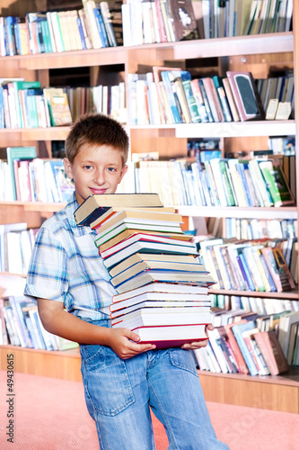 Photo: Boy with paper books Boy with paper books