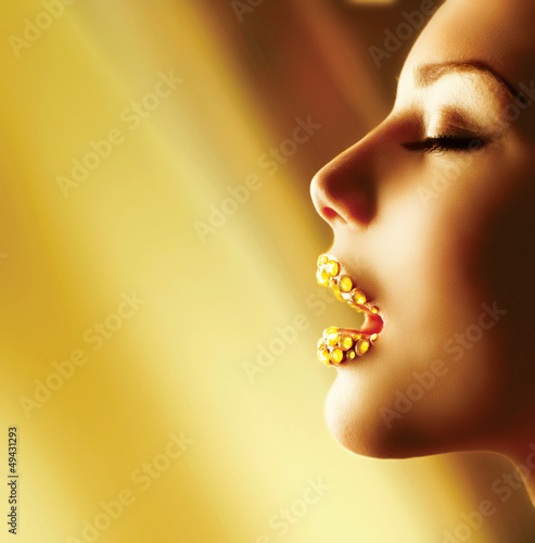 Photo: Luxury Golden Makeup. Beautiful Professional Holiday Make-up Luxury Golden Makeup. Beautiful Professional Holiday Make-up