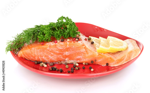 Photo: Fresh salmon fillet with herbals and lemon slices Fresh salmon fillet with herbals and lemon slices