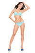 Young woman with lingerie (bikini) in front of white background