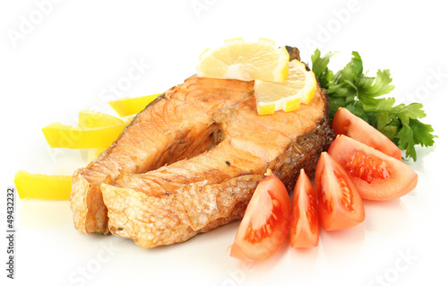 Photo: Appetizing grilled salmon with lemon and vegetables isolated Appetizing grilled salmon with lemon and vegetables isolated