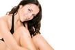 Woman with black bikini sitting in the studio